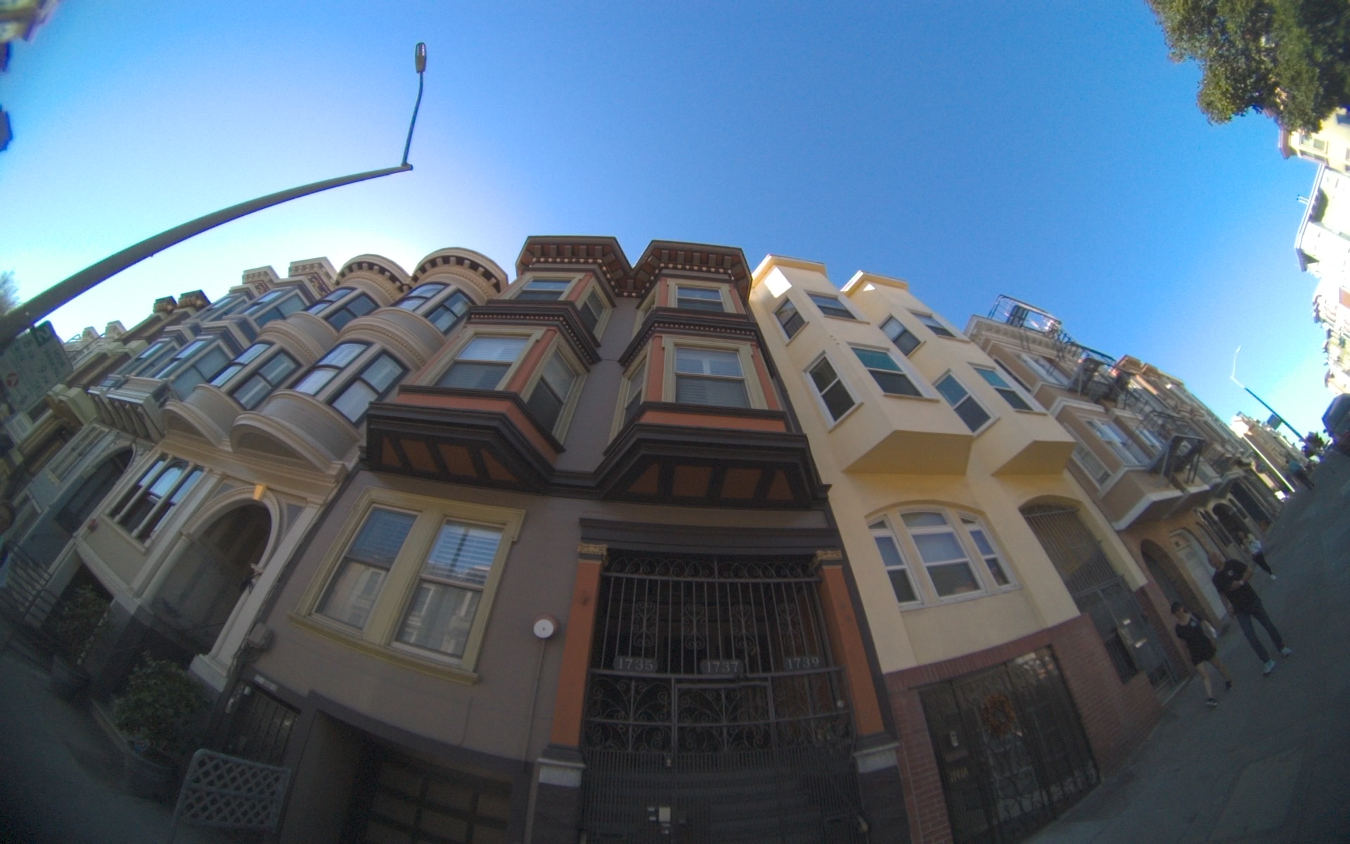 Victorian houses beneath a blue sky