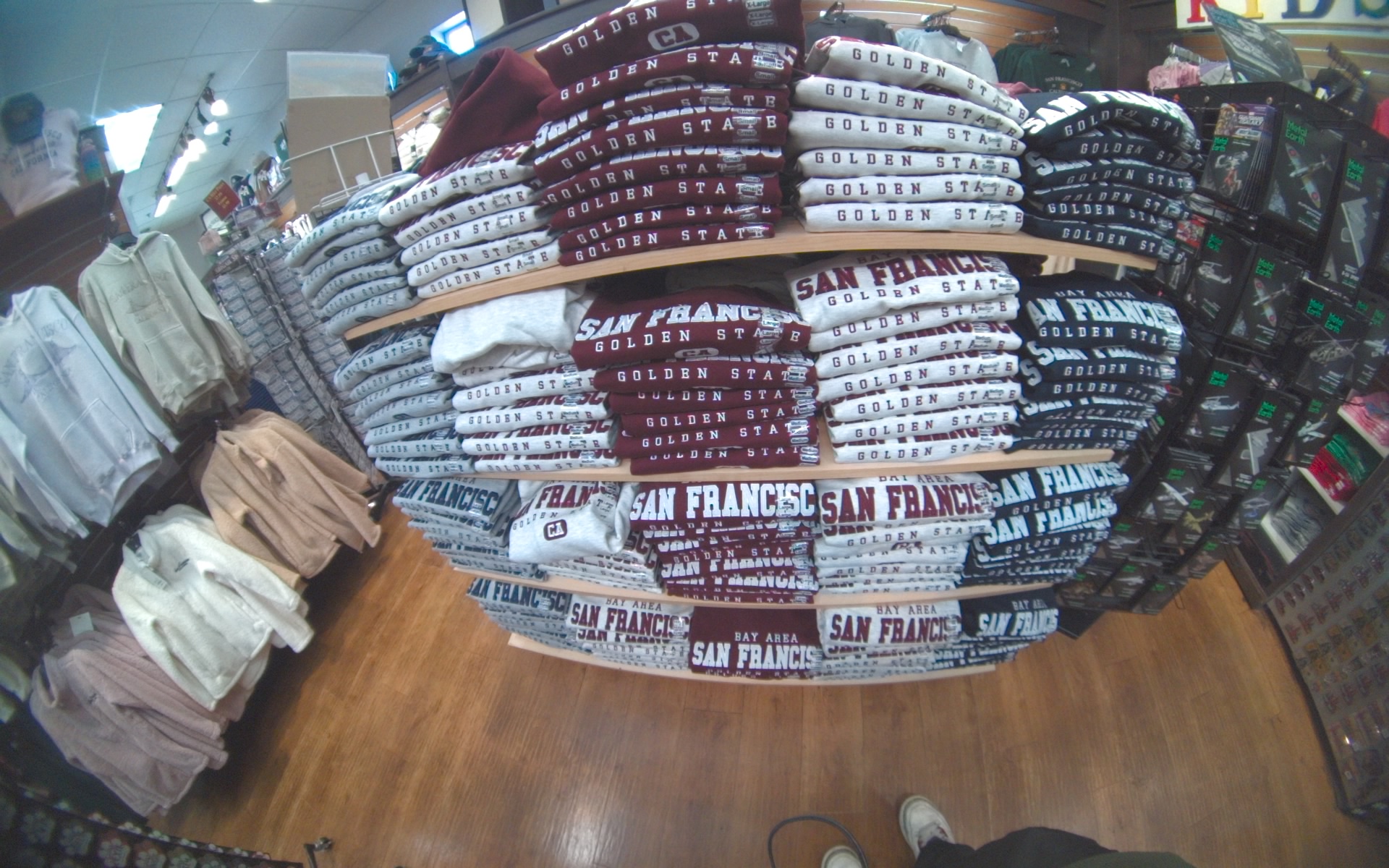 Folded souvenir sweatshirts in a shop